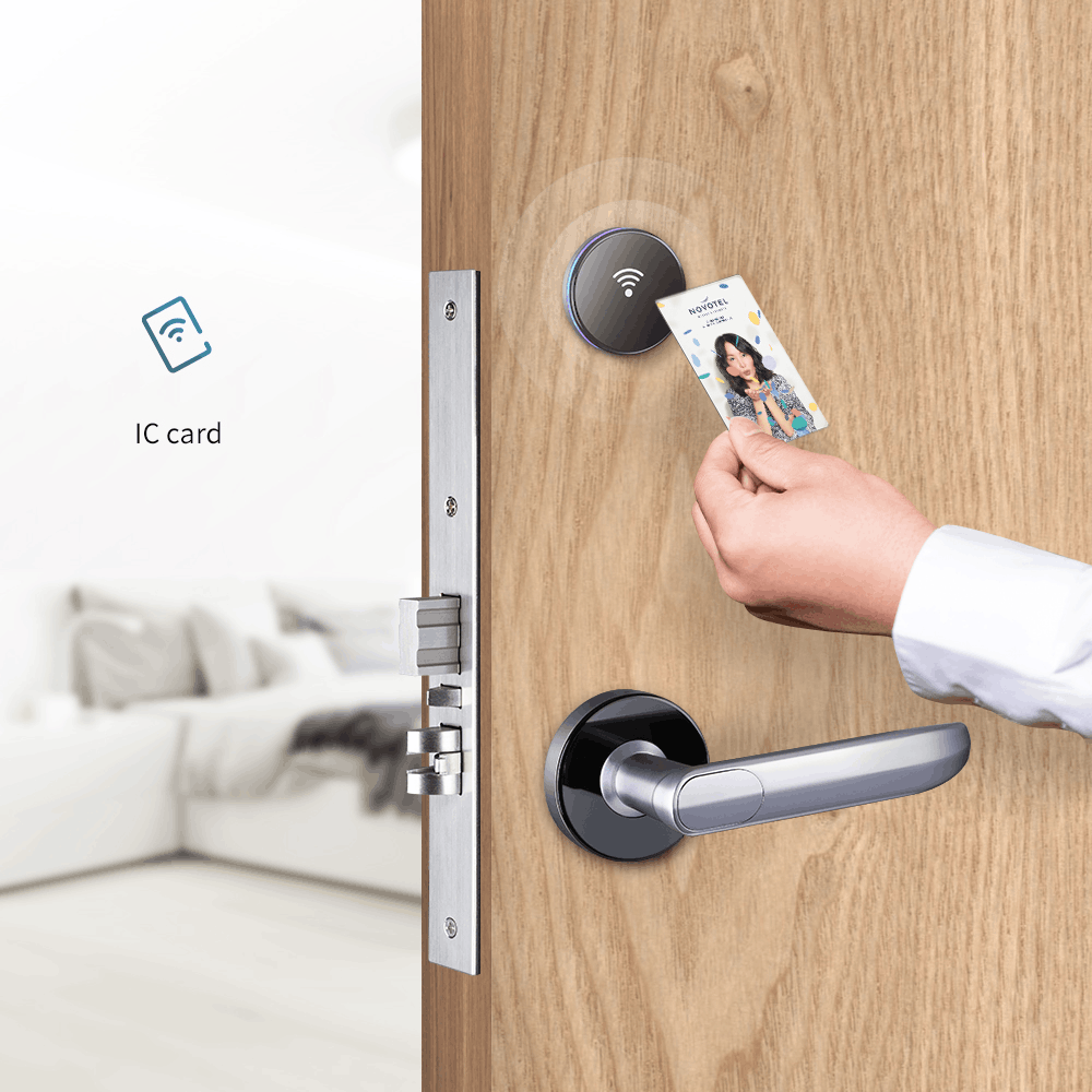 Guest using a key card on the HLS190 hotel lock with silver handle