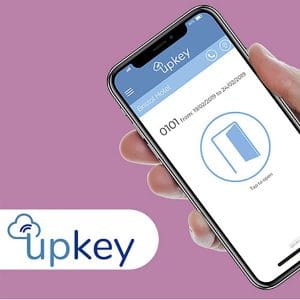 UpKey App Access Management displayed on a smartphone, providing secure digital hotel room access and contactless guest entry.