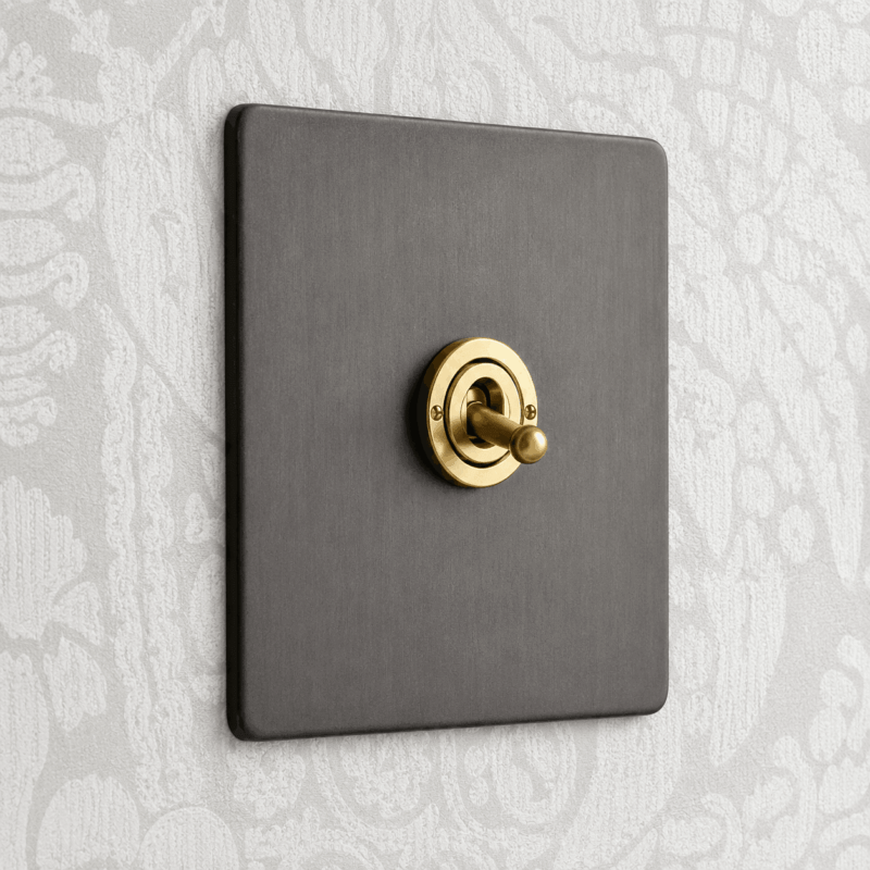 Verona Range grey light switch with gold colour toggle for hotel guest rooms by Hotel Lock and Safe