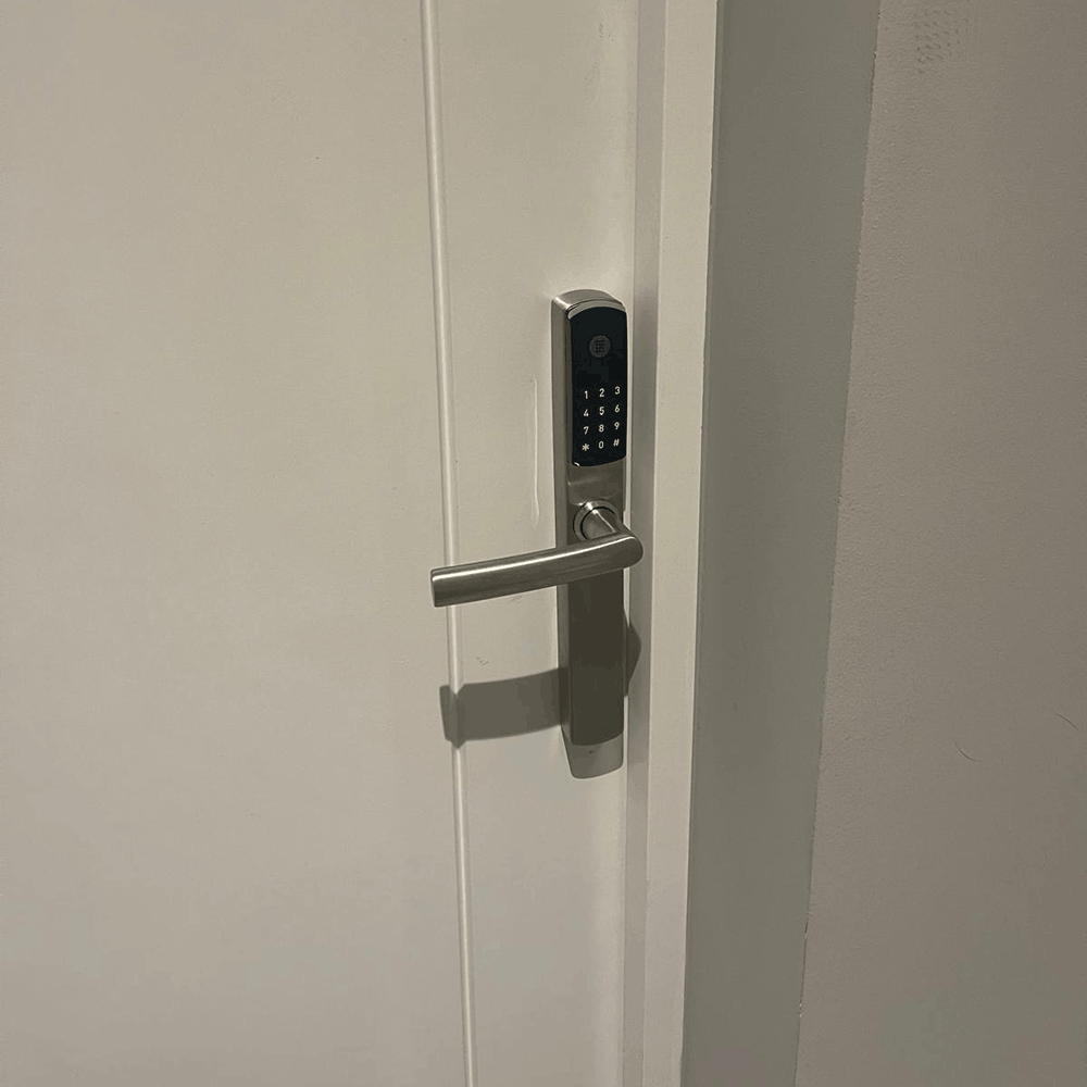 Omnitec os slim code hotel door lock in silver on a guest room door by hotel lock and safe