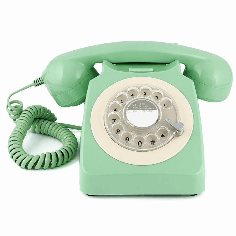 hotel green analogue rotary dialling telephone on white back ground